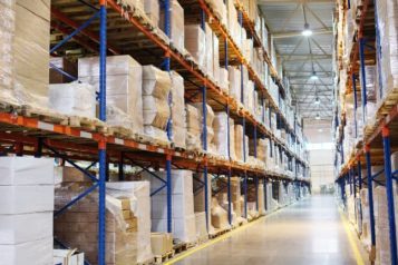 Warehouse corridor filled with plastic covered boxes